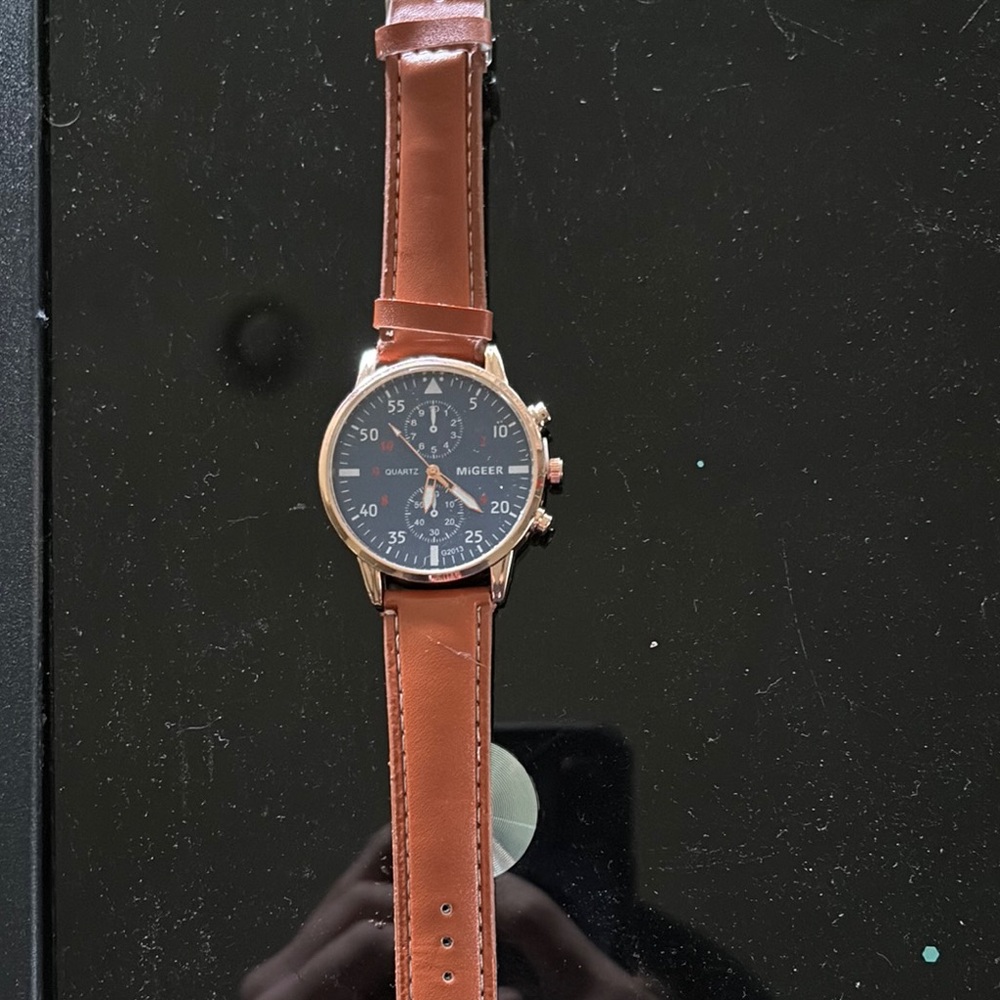 migeer watch with navy dial and brown leather watch band